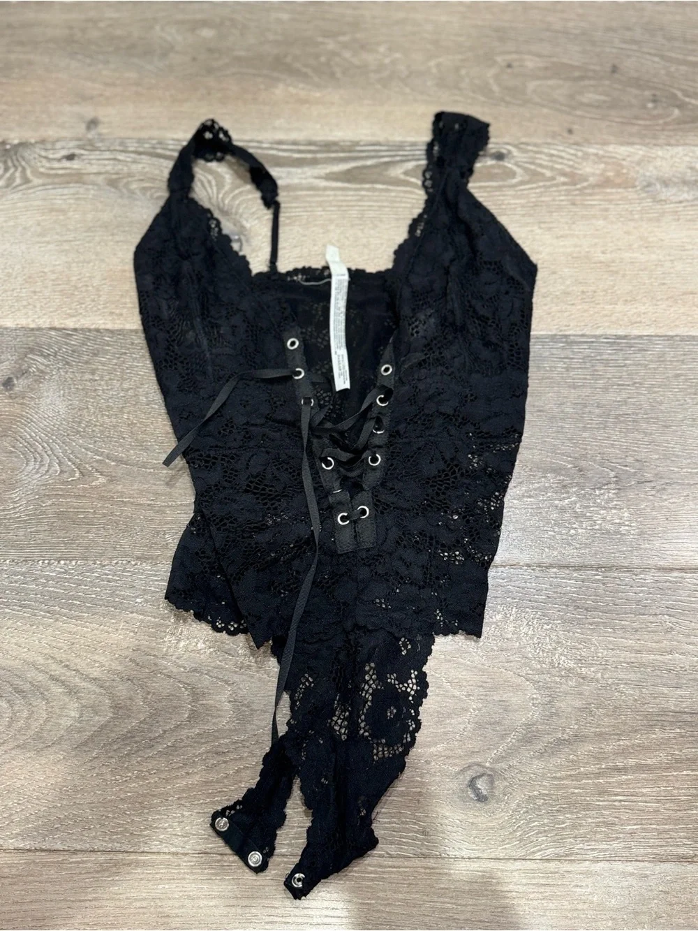 Free People lace bodysuit features a distinct lace-up front detail 1193